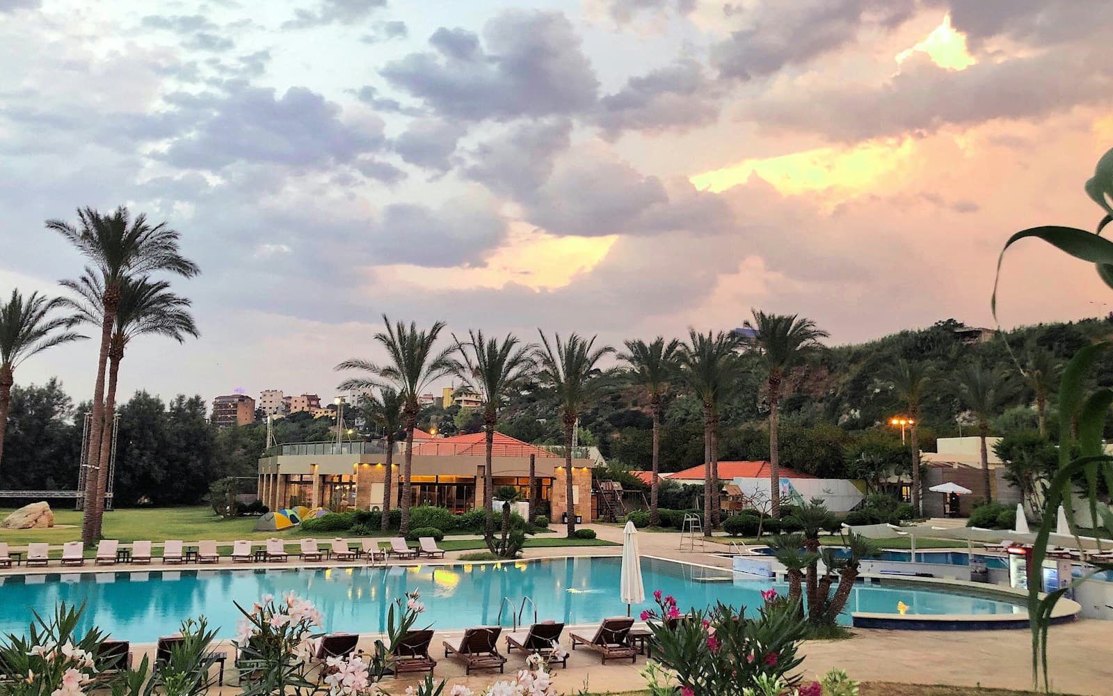 Heated resort swimming pool and spa at sunset
